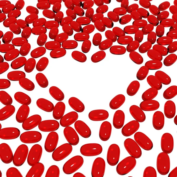 Forme de coeur avec des capsules rouges — Photo