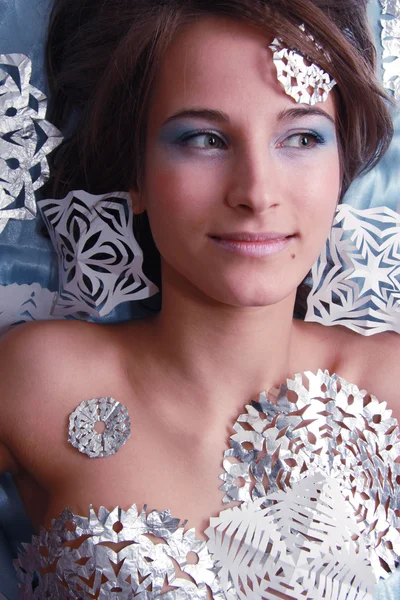 Portrait of young girl with makeup and cut snowflakes — Stock Photo, Image