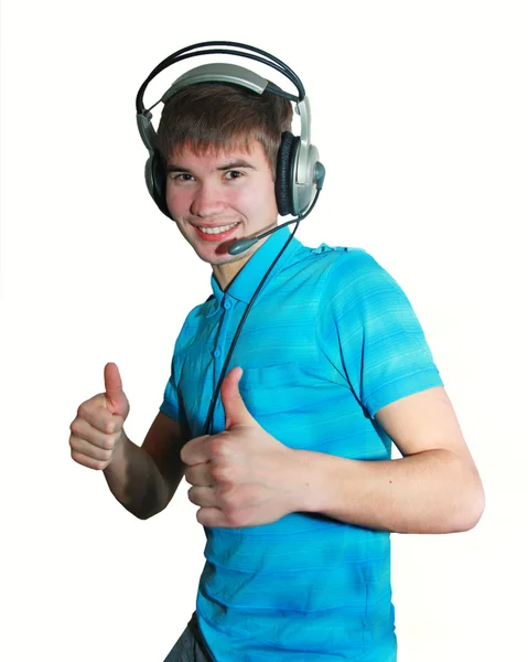 Attraktiver Junger Mann Blauem Shirt Mit Kopfhörern Und Daumen Hoch lizenzfreie Stockbilder