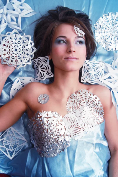 Portrait of young girl with makeup and cut snowflakes — Stock Photo, Image