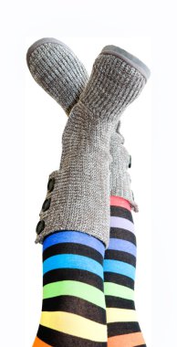 Stripy legs - female legs in brightly colored stockings and knit clipart