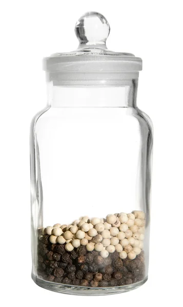 Small glass container with black and white peppercorns, isolated — Stock Photo, Image