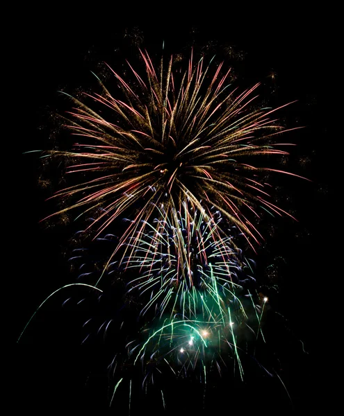 Few fireworks blasts on black sky - long exposure — Stock Photo, Image