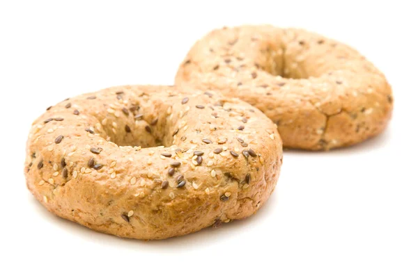 Two multigrain bagels isolated on white — Stock Photo, Image