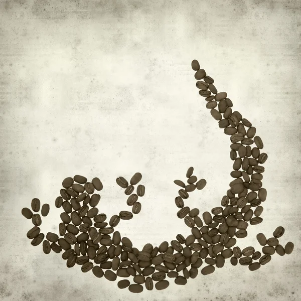 stock image Textured old paper background with lizard made of coffee beans