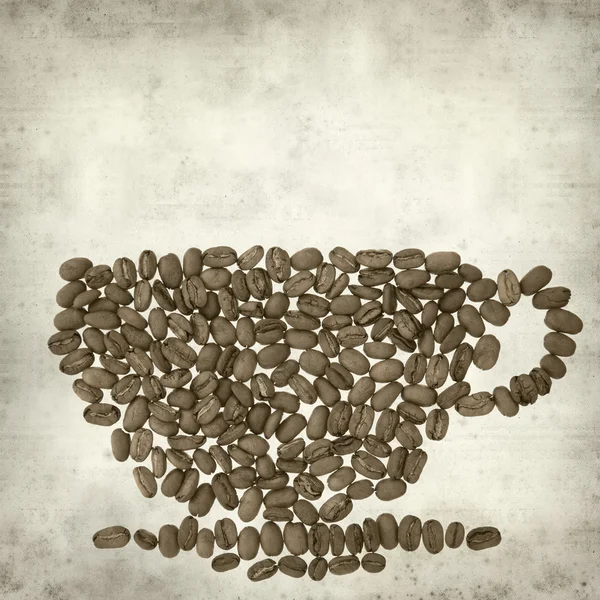 古い用紙の背景のテクスチャのコーヒー豆のカップを — ストック写真