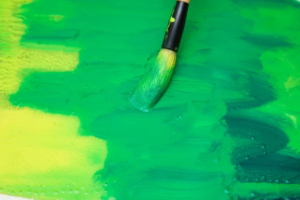 Thick calligraphy brush making a thick layer of paint on glass surface - pr — Stock Photo, Image