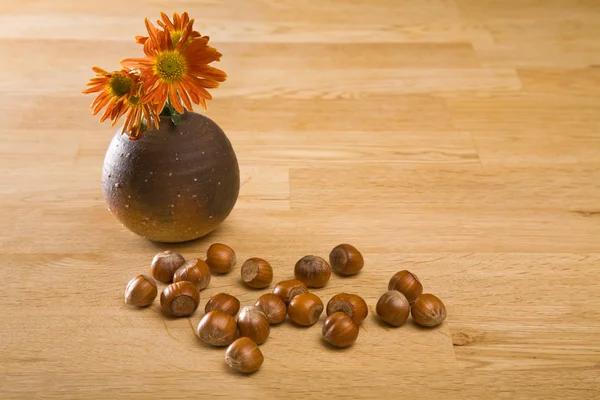 Autumnal Still Life Hazelnuts Spray Orange Chrysanthemum Small Brown Vase — Stock Photo, Image