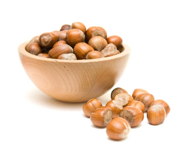 Hazelnuts in small wooden bowl isolated on white backgound; — Stock Photo, Image