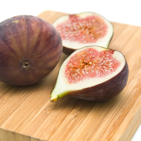 Three Ripe Purple Fig Fruits Small Wooden Cutting Borad Isolated — Stock Photo, Image