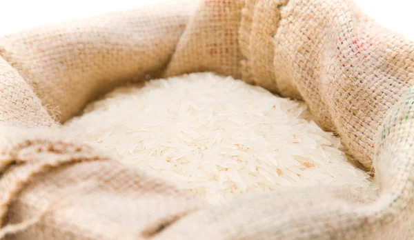 Fine long-grained basmati rice in a burlap sack — Stock Photo, Image