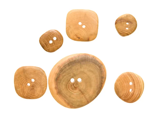 Drewniane guziki o różnych rozmiarach, na białym tle, — Zdjęcie stockowe