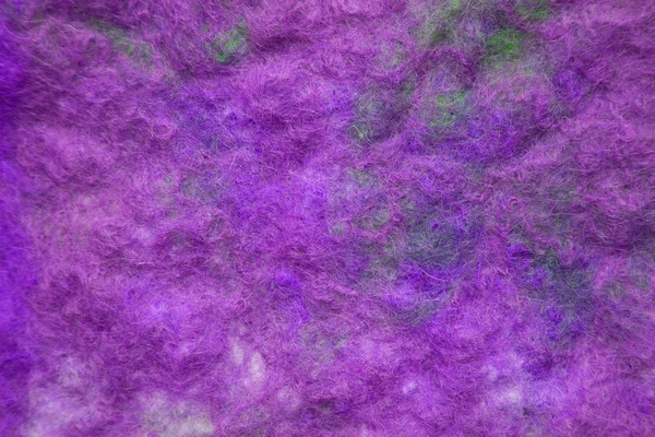 Feutre fait à la main dans un schéma de couleurs lilas - fond de texture — Photo