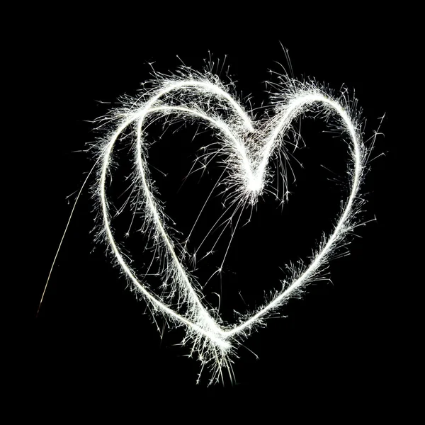 Символічна форма серця намальована в повітрі з іскровим слідом — стокове фото