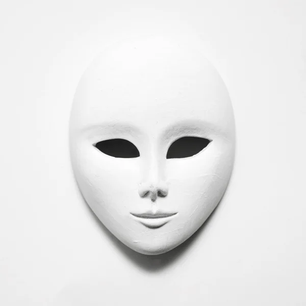 White mask on white paper; square format — Stock Photo, Image