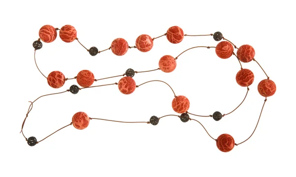Simple necklace - sponge coral and lacy metal beads on a thin leather cord; — Stock Photo, Image