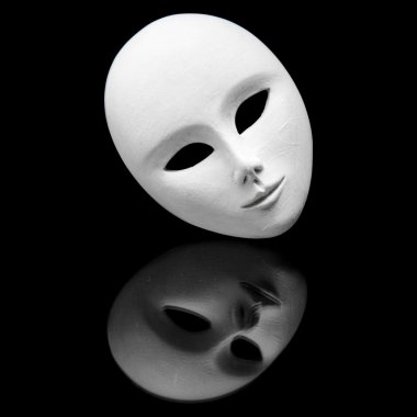 White impassive venetiain mask and its reflection in black mirror