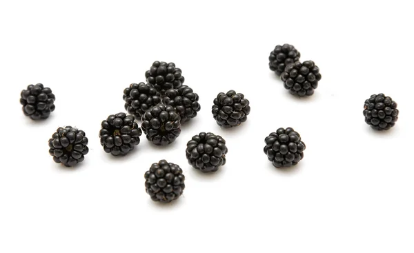Handful of ripe scattered blackberries isolated on white backgro — Stock Photo, Image