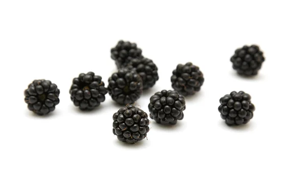 Handful of ripe scattered blackberries isolated on white backgro — Stock Photo, Image