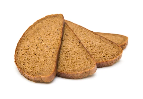 Τέσσερις στοιβάζονται fanned φέτες ψωμί σίκαλης με κύμινο σπόρους που απομονώνονται σε Γουίτ — Φωτογραφία Αρχείου