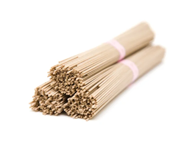 stock image Three stacked bundles of Japanese buckwheat soba noodle; isolated on white