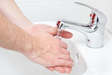 Close-up of human hands being washed clipart