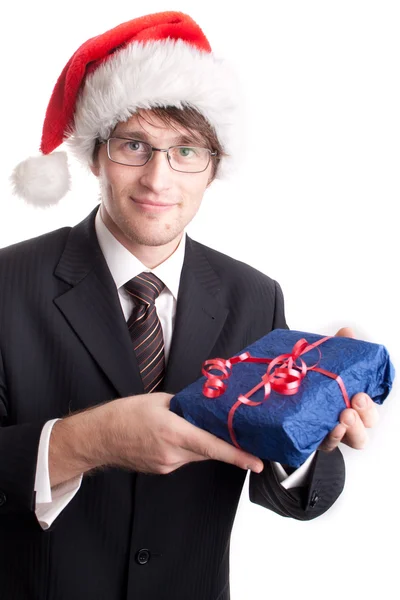 Handsome businessman offering a christmas gift — Stock Photo, Image
