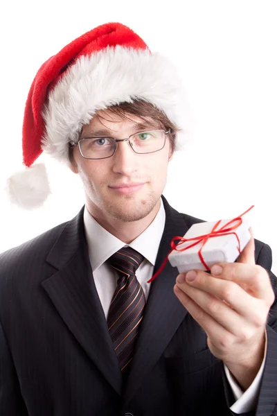 Handsome businessman offering a christmas gift — Stock Photo, Image