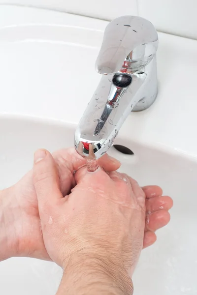 Close-up of human hands being washed — Stock Photo, Image