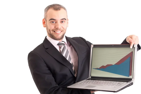 Ділова людина вказує на ноутбук з графом ізольовано на білому — стокове фото