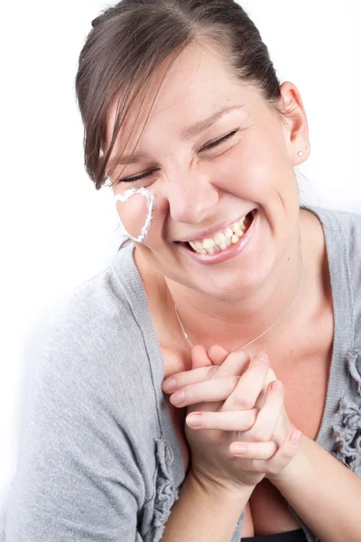 Photo of the woman with cream heart on the face — Stock Photo, Image