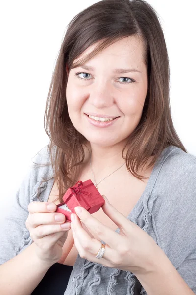 stock image Portrait of a young girl on a white background holding valentine gift