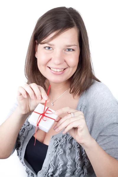 Portrait of a young girl on a white background holding valentine gift — Stock Photo, Image