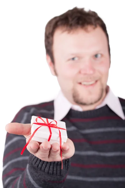 Young man holding valentine gift in his hand — Stock Photo, Image