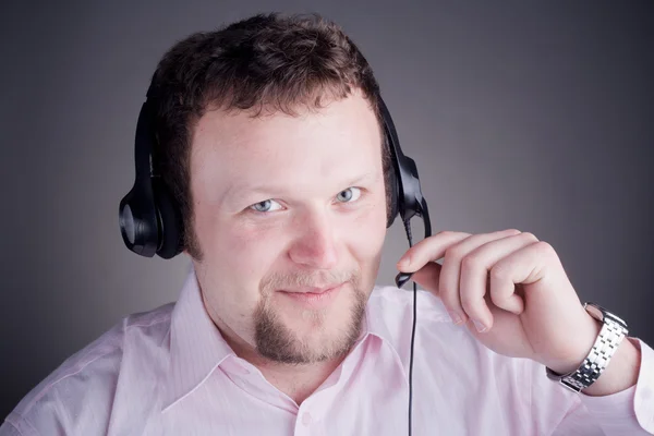 Uśmiechnięty mężczyzna klienta usługi operatora w słuchawki Zdjęcia Stockowe bez tantiem