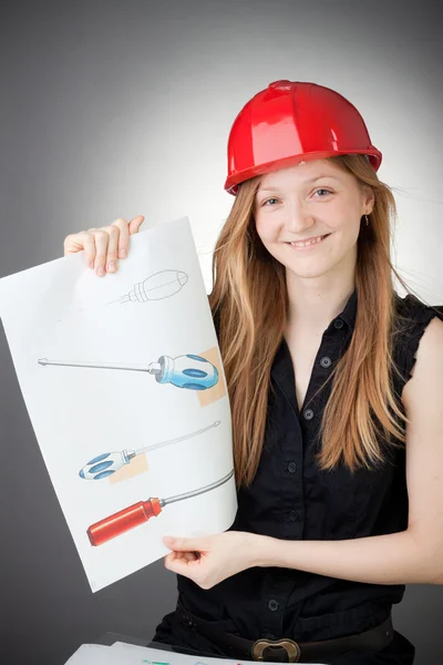 Young Design Engineer Woman Shows a Screwdriver Design Plan — Stock Photo, Image