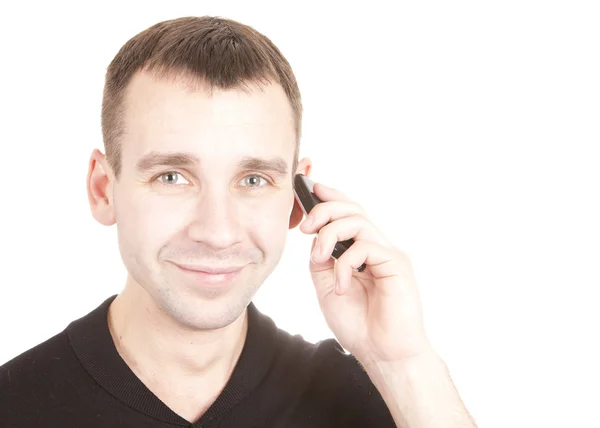stock image Portrait of a happy young guy speaking on cellphone