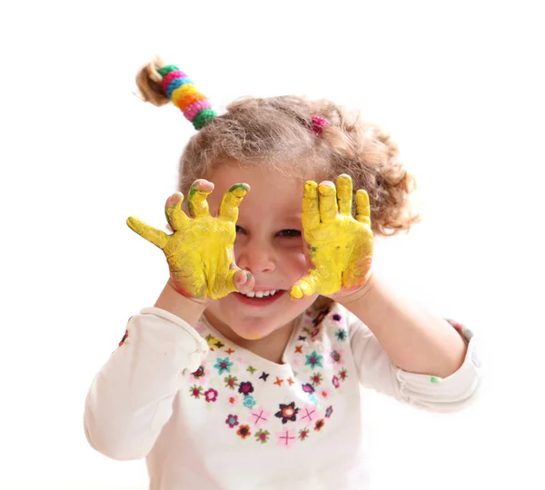 Girl with paint hands isolated on white — Stock Photo, Image