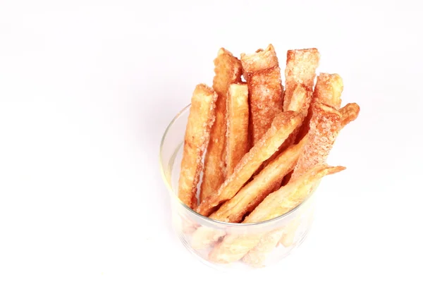 stock image Bread sticks in a glass beaker isolated on a white background