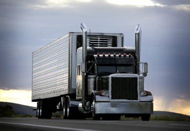 Big truck driving on a highway clipart