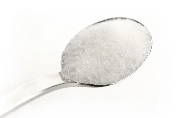 Açúcar em uma colher — Fotografia de Stock