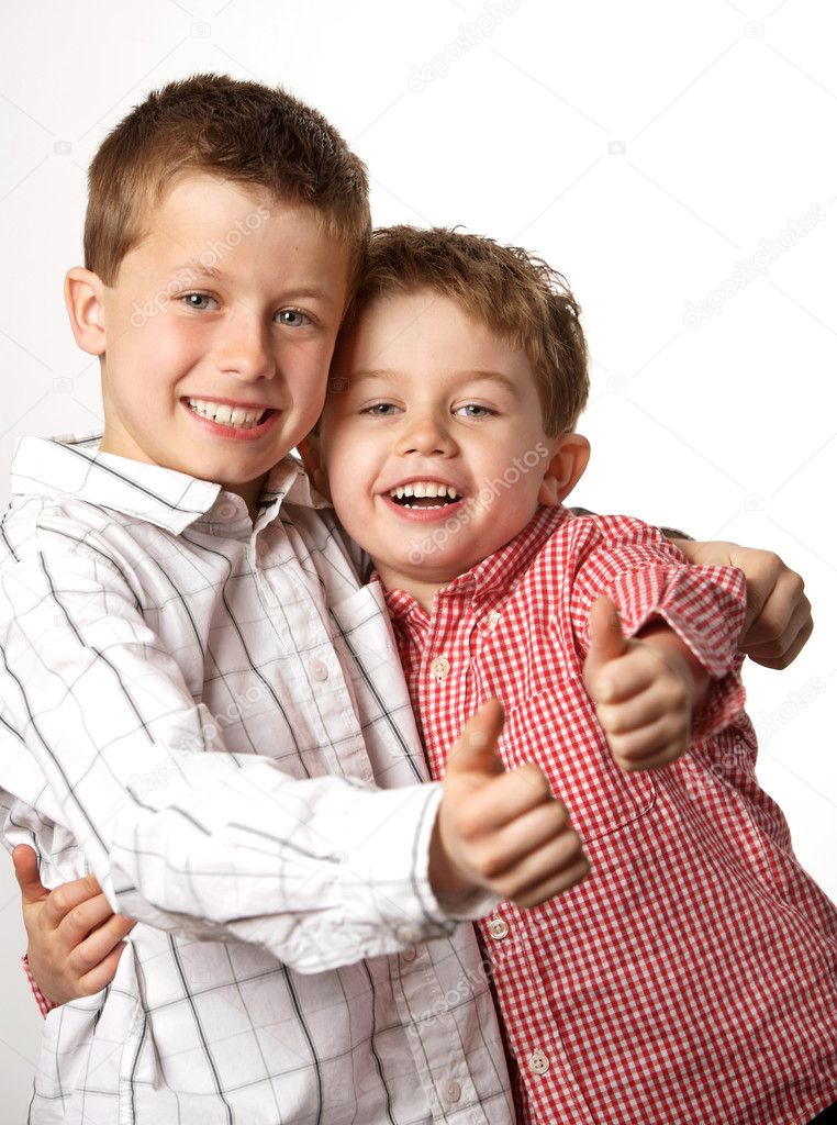 Two young boys with thumbs up