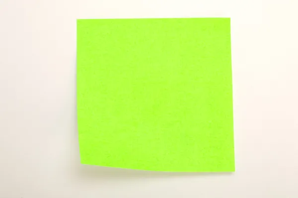 Neon green post it over white background — Stock Photo, Image