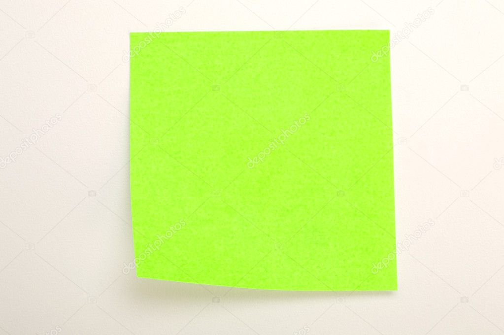 Neon green post it over white background