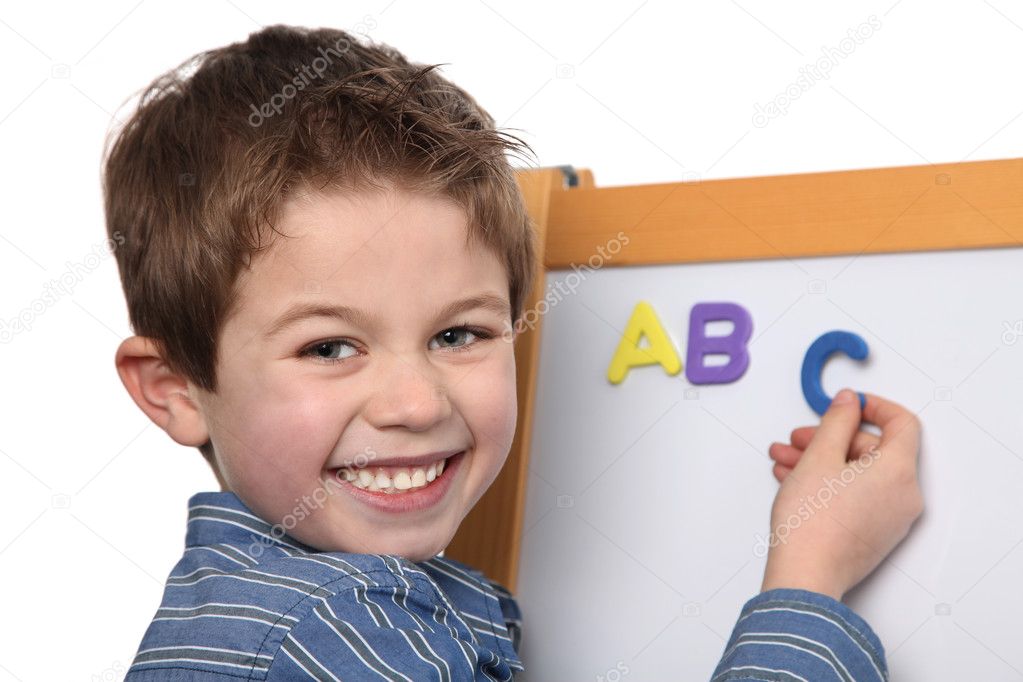 Cute young boy learning the ABC