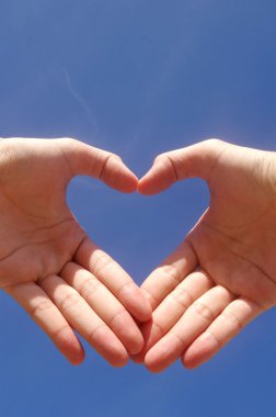 A man hand forming a heart clipart