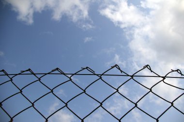 Chain link fence see blue sky clipart