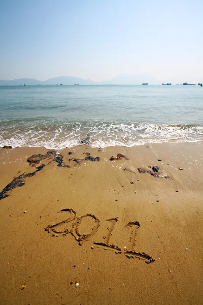 2011 schrijft op zand — Stockfoto
