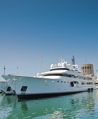 Luxury yacht moored in a marina in the Mediterranean clipart