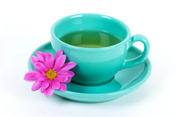 Green cup and flower — Stock Photo, Image